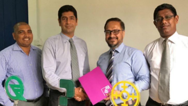 Shiraz Lye, Director Sales & Marketing South Asia - IFS handing over the agreement to Pawan Tejwani, Managing Director of Cable Solutions Lanka, as Mithila Ranjithan- Principal Consultant IFS South Asia and Priyanka Irugalbandara, Director Quality Floors Lanka look on. (Image credit IFS)