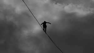 Tightrope - Photo by Marcelo Moreira: https://www.pexels.com/photo/low-angle-photo-grayscale-of-person-tightrope-walking-2225771/