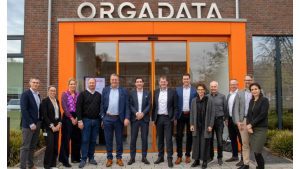 Marcus Pannier (center), Regional President at Forterro, alongside Bernd Hillbrands (to his right), founder of Orgadata, with their respective leadership teams in front of the Orgadata headquarters in Leer.